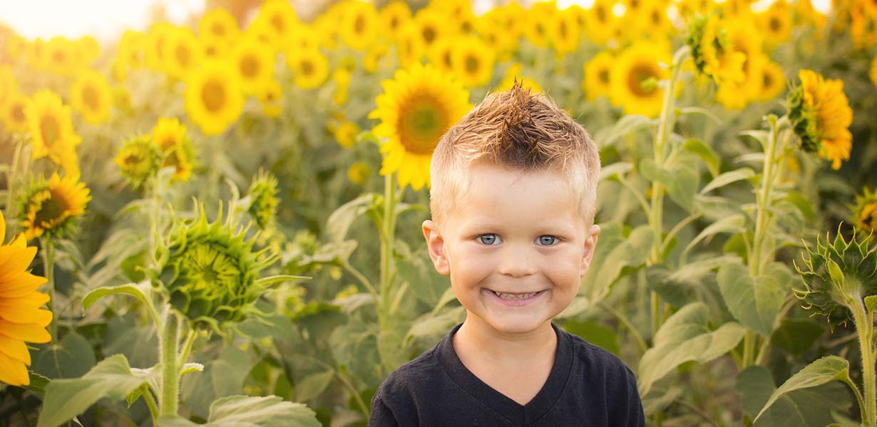 Child with sunflowers